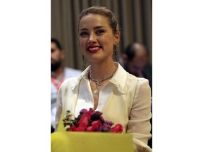 American actress Amber Heard smiles after meeting with Syrian refugees and medical volunteers in Amman, Jordan, Thursday, April 5, 2018. Heard, 31, said the experience has left an "indelible mark" on her.