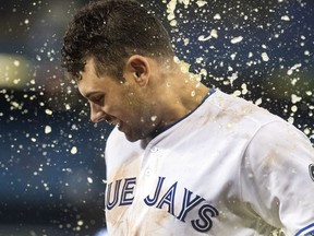Toronto Blue Jays catcher Luke Maile gets a sports drink shower after he hit a walk-off, game-winning single against the Kansas City Royals on April 17.