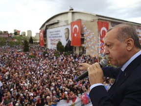 Turkey's President Recep Tayyip Erdogan addresses the members of his ruling Justice and Development Party, in Denizli, Turkey, Saturday, April 7, 2018.