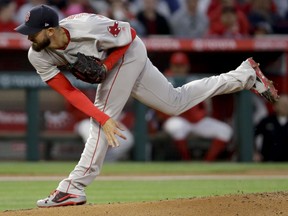 Boston Red Sox starting pitcher Rick Porcello throws to a Los Angeles Angels batter during the first inning of a baseball game in Anaheim, Calif., Wednesday, April 18, 2018.