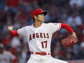 Los Angeles Angels starting pitcher Shohei Ohtani throws to a Boston Red Sox batter during the first inning of a baseball game Tuesday, April 17, 2018, in Anaheim, Calif.