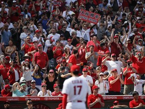 Fans cheer as Los Angeles Angels starting pitcher Shohei Ohtani (17), of Japan, heads to the dugout after the sixth inning of a baseball game against the Oakland Athletics, Sunday, April 8, 2018, in Anaheim, Calif.