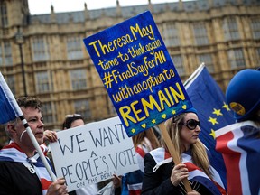 Anti-Brexit campaigners demonstrate outside the Houses of Parliament in London, England, on April 9, 2018.