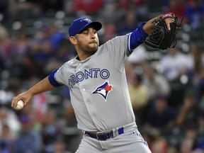 Toronto Blue Jays starting pitcher Marco Estrada works against the Texas Rangers during the first inning of a baseball game Friday, April 6, 2018, in Arlington, Texas.