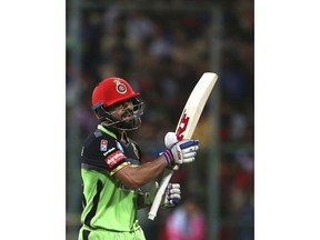 Royal Challengers Bangalore captain Virat Kohli reacts as he leaves the ground after losing his wicket during the VIVO IPL Twenty20 cricket match against Rajasthan Royals in Bangalore, India, Sunday, April 15, 2018.