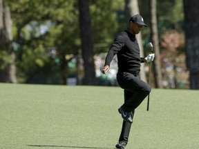 Tiger Woods reacts to his shot on the second hole during the first round at the Masters golf tournament Thursday, April 5, 2018, in Augusta, Ga.