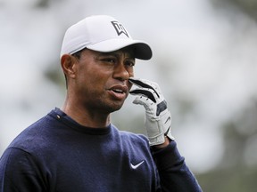 Tiger Woods walks off the fourth tee during a practice round for the Masters golf tournament Wednesday, April 4, 2018, in Augusta, Ga.