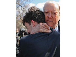 FILE-In this Tuesday, March 13, 2018. file photo, Sen. Orrin Hatch, R-Utah, center, hugs Kyle Kashuv, 16, and Patrick Petty, 17, both from Parkland, Fla., following a news conference on Capitol Hill in Washington. A Florida school district is looking into claims that a Marjory Stoneman Douglas teacher said Kashuv was acting like Adolf Hitler. The Sun Sentinel reports the controversy involves history teacher Greg Pittman, who supports gun control, and junior Kyle Kashuv, who has defended gun rights following the mass shooting at their school.