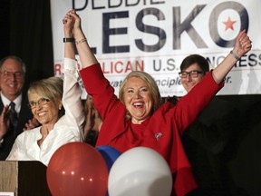 Republican U.S. Congressional candidate Debbie Lesko, right, celebrates her win with former Arizona Gov. Jan Brewer at her home, Tuesday, April 24, 2018, in Peoria, Ariz. Lesko ran against Democratic candidate Hiral Tipirneni for Arizona's 8th Congressional District seat being vacated by U.S. Rep. Trent Franks, R-Arizona.