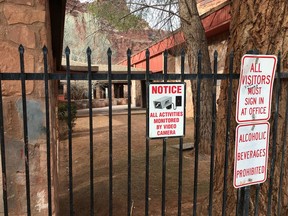 In this Feb. 17, 2018 photo, a fence surrounds Havasupai Elementary, reminding visitors that they're under surveillance in Havasupai, Ariz. Lawyers for the students on the Havasupai reservation say they've won a major legal victory in a case that could reform the U.S. Bureau of Indian Education. A federal court recently rejected arguments from Justice Department attorneys that childhood adversity and trauma are not learning disabilities.