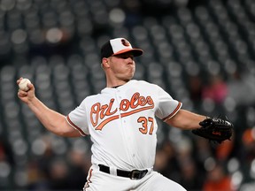 Baltimore Orioles starting pitcher Dylan Bundy delivers during the first inning of a baseball game against the Toronto Blue Jays, Monday, April 9, 2018, in Baltimore.