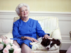 U.S. first lady Barbara Bush poses with her dog Millie in 1990.
