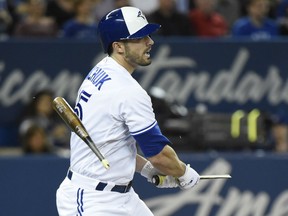 Randal Grichuk of the Blue Jays breaks his bat on an infield out during fourth inning action against the Boston Red Sox at Rogers Centre in Toronto on Thursday night.