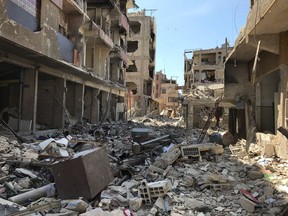 Rubble fills a street in Douma, the site of a suspected chemical weapons attack, near Damascus, Syria, Monday, April 16, 2018.