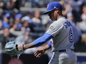 Blue Jays pitcher Marcus Stroman reacts as he walks off the field after being relieved in the sixth inning of their game against the Yankees on Saturday in New York.