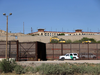 A U.S. border patrol vehicle guards the bank of the Bravo River, the natural border between the cities of El Paso, Texas and Ciudad Juarez in Mexico, on April 4, 2018.