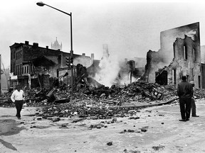 Smouldering ruins remain where a building stood at 7th and O streets in northwest Washington on April 6, 1968.