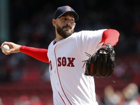 Boston Red Sox starting pitcher Rick Porcello delivers against the Tampa Bay Rays during the first inning of a baseball game at Fenway Park in Boston Saturday, April 7, 2018.