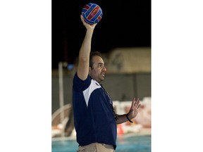 FILE - In this Sept. 23, 2013, file photo, Bahram Hojreh coaches youngsters at at the USA Water Polo National Training Center in Los Alamitos, Calif. Hojreh, who ran a club affiliated with USA Water Polo, has been charged with the sexual abuse of seven underage female players during one-on-one coaching sessions, prosecutors said Wednesday, April 4, 2018. The victims were underage female water polo players and the alleged crimes occurred between 2014 and January of this year, the Orange County district attorney's office said.