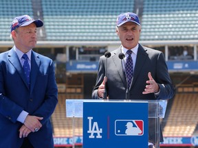 Los Angeles President and CEO Stan Kasten, left, and Baseball Commissioner Rob Manfred announce that Dodger Stadium will host the All-Star Game in 2020 for the first time since 1980 at a news conference in Los Angeles Wednesday, April 11, 2018.