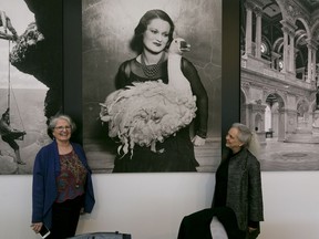 This Thursday, April 19, 2018, photo shows exhibition curator Anne Wilkes Tucker, left, and Library of Congress photo curator Beverly Brannan, right, during a media preview of the exhibit "Not An Ostrich: And Other Images From America's Library," at the Annenberg Space For Photography in Los Angeles.