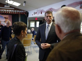 Investment Industry Regulatory Organization of Canada President and CEO Andrew Kriegler meets with community members to explain how new legislation will better protect seniors and vulnerable investors during an event at James Bay New Horizons in Victoria, B.C., on Friday April 27, 2018.