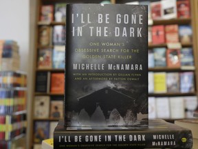 This Wednesday, April 25, 2018 photo shows copies of the books "I'll Be Gone in the Dark: One Woman's Obsessive Search for the Golden State Killer" by Michelle McNamara at a Books Inc. bookstore in San Francisco. California authorities say a man they suspect of being a serial killer tied to dozens of slayings and sexual assaults in the 1970s and '80s has been charged with murder.