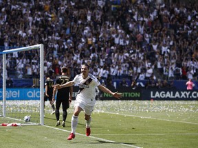 Los Angeles Galaxy's Zlatan Ibrahimovic, of Sweden, celebrates his second goal of the game during the second half of an MLS soccer match against the Los Angeles FC Saturday, March 31, 2018, in Carson, Calif. The Galaxy won 4-3.