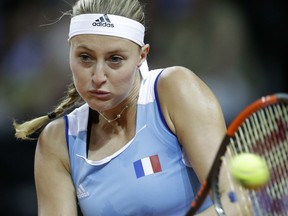 France's Kristina Mladenovic returns a ball to United States' Sloane Stephens during her Fed Cup semifinal singles tennis match, in Aix-en-Provence, southern France, Sunday, April 22, 2018.