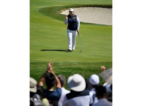 Inbee Park, of South Korea, acknowledges the crowd after making a birdie putt on the seventh hole during the final round of the HUGEL-JTBC LA Open golf tournament at Wilshire Country Club, Sunday, April 22, 2018, in Los Angeles.