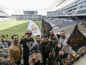 Fans of Los Angeles FC pose for photo prior to an MLS soccer game against the Seattle Sounders at the new Banc of California Stadium in Los Angeles, Sunday, April 29, 2018.