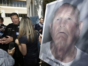 Sacramento County Sheriff Scott Jones, left, talks to reporters about the arrest Joesph James DeAngelo, seen in photo, on suspicion of committing a string of violent crimes in the 1970's and 1980's after a news conference. Wednesday, April 25, 2018, in Sacramento, Calif. A DNA match led to the arrest of DeAngelo, 72, Tuesday. DeAngelo is believed to have committed at least 12 slayings and 45 rapes in California.