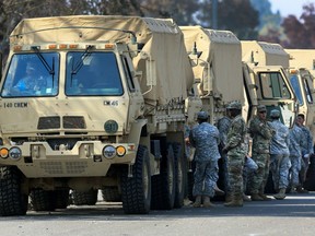 This Oct. 16, 2017,  photo shows the California National Guard deployed near Santa Rosa, Calif. President Donald Trump slammed California Gov. Jerry Brown's posture on sending National Guard troops to the Mexican border Tuesday, April 17, 2018, even as Brown said he was nearing agreement on joining the president's mission and that his troops were "chomping at the bit ready to go."