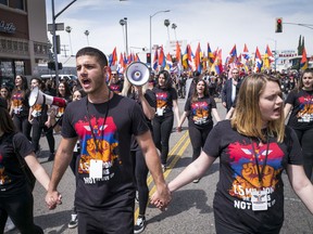 Thousands attend a march in Hollywood, Calif., on Tuesday, April 24, 2018, to commemorate the 103rd anniversary of the Armenian Genocide.