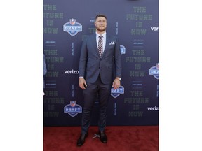 UCLA's Kolton Miller poses for photos on the red carpet before the first round of the NFL football draft, Thursday, April 26, 2018, in Arlington, Texas.