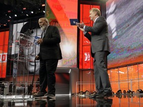 Pro Football Hall of Famer Jim Brown, left, announces Austin Corbett as the Cleveland Browns' selection during the second round of the draft, as NFL Commissioner Roger Goodell applauds, Friday, April 27, 2018, in Arlington, Texas.