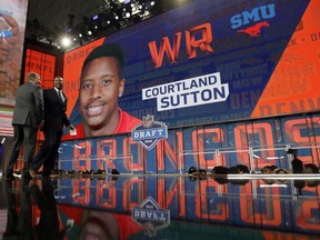 NFL Commissioner Roger Goodell and former Denver Broncos player Stephen Atwater walk off the stage after announcing SMU's Courtland Sutton as the Broncos' pick during the second round of the NFL football draft Friday, April 27, 2018, in Arlington, Texas.