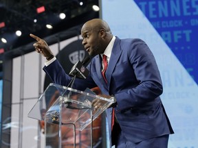 Former player Vince Young announces Boston College's Harold Landry as the Tennessee Titans' pick during the second round of the NFL football draft, Friday, April 27, 2018, in Arlington, Texas.