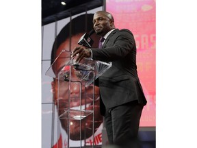 Former player Priest Holmes announces Mississippi's Breeland Speaks as the Kansas City Chiefs' selection during the second round of the NFL football draft Friday, April 27, 2018, in Arlington, Texas.