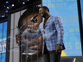 Former Chargers player LaDainian Tomlinson announces Southern California's Uchenna Nwosu as the Los Angeles Chargers' selection during the second round of the NFL football draft Friday, April 27, 2018, in Arlington, Texas.
