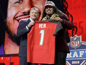 Washington's Vita Vea, right, poses with commissioner Roger Goodell after being picked by the Tampa Bay Buccaneers during the first round of the NFL football draft, Thursday, April 26, 2018, in Arlington, Texas.