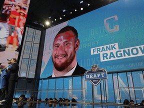 Commissioner Roger Goodell, left, poses with a fan after the Detroit Lions selected Frank Ragnow during the first round of the NFL football draft, Thursday, April 26, 2018, in Arlington, Texas.