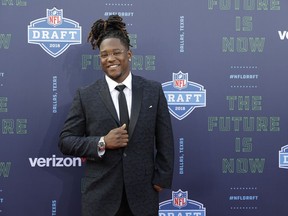 Central Florida's Shaquem Griffin poses for photos on the red carpet before the first round of the NFL football draft, Thursday, April 26, 2018, in Arlington, Texas.