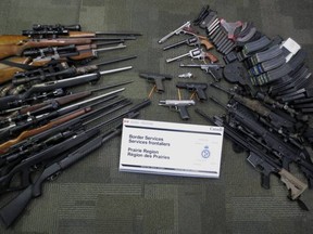Authorities found eight handguns, 16 long guns and 70 over-capacity ammunition magazines that had not been declared, the CBSA said.