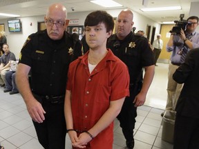 FILE - In this Feb. 19, 2016, file photo, Ethan Couch is led to a juvenile court for a hearing in Fort Worth, Texas. Couch, who used an "affluenza" defense in a fatal drunken-driving wreck in 2013, was released from jail Monday, April 2, 2018, after serving nearly two years for a revoked probation.