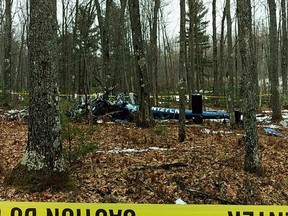 This image provided by the Oneida County Sheriff's Office in Rhinelander, Wis., shows the wreckage of a medical helicopter that was found early Friday, April 27, 2018, after it crashed in Hazelhurst, Wis. Authorities said the people aboard, all crew members, were killed. There were no patients on board. The last known contact with the helicopter was at 10:55 p.m. Thursday. (Oneida County Sheriff's Office via AP)