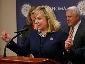FILE - In this March 28, 2018 file photo, Oklahoma Gov. Mary Fallin speaks during a news conference following a vote on a package of tax hikes to fund teacher pay raises in Oklahoma City. Fallin says public school teachers who are striking for more classroom funding are like "a teenage kid that wants a better car." In an interview with CBS News, Tuesday, April 3, 2018. Fallin signed legislation last week increasing teacher pay but teachers have been on strike for more.
