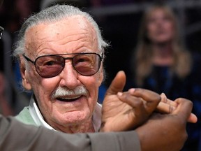 Famed comic book creator Stan Lee appears at an NBA basketball game between the Los Angeles Lakers and the Toronto Raptors, in Los Angeles. A Chicago masseuse is suing Marvel Comic's Stan Lee, accusing him of inappropriate behaviour during two massages in 2017.