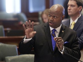 FILE - In this May 25, 2016 file photo, Illinois Rep. Emanuel "Chris" Welch, D-Westchester, speaks to lawmakers at the Capitol in Springfield, Ill. Legislation before the Illinois House would replace school-based police officers with social workers. Rep. Welch is sponsoring the plan to address what proponents say is needless arrests of blacks and other minority students. A group called Voices of Youth in Chicago Education says police officers aren't equipped to handle behavioral health issues and commonly arrest students for non-violent behavior.