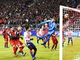 Chivas Guadalajara fire the ball past Toronto FC goalkeeper Alex Bono on April 17.